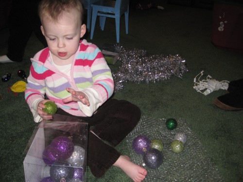 Eve playing with ornaments