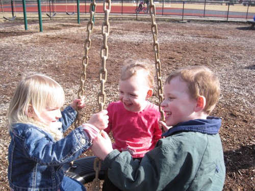 Three on a tire swing