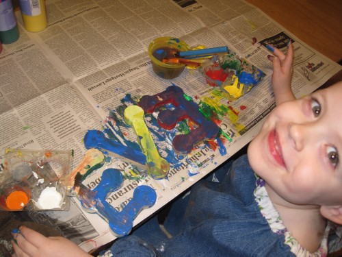 Eve painting her letters