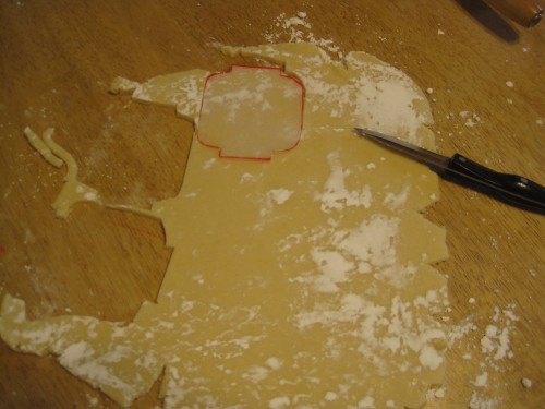 hand cutting cookies