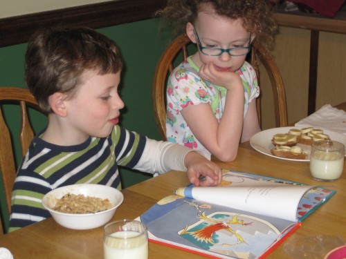 Because it was her birthday, Lex agreed to read her new book out loud at breakfast.  She loves when Lex reads to her.